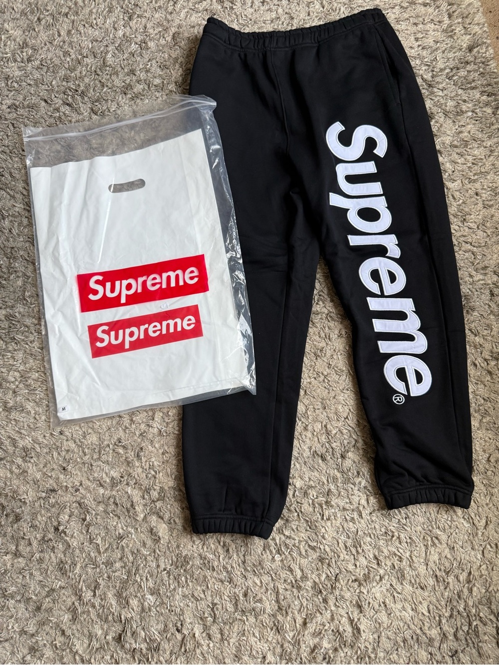 Supreme Black Joggers with Large White Vertical Logo